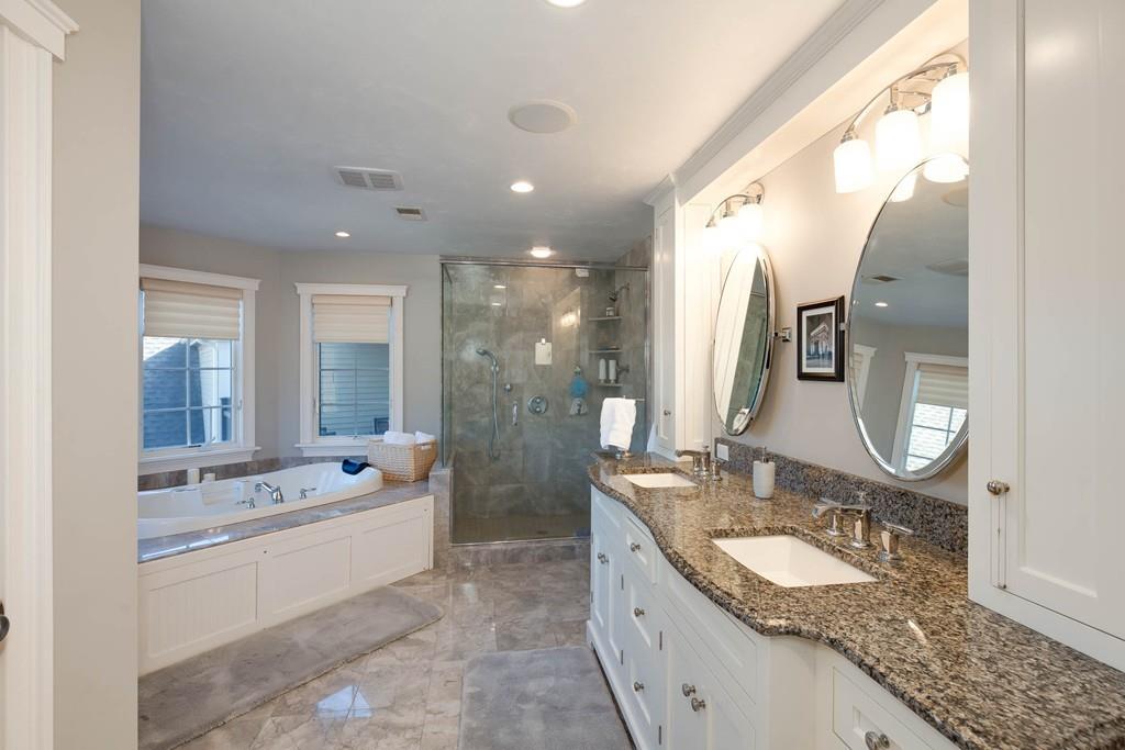 121 Douglas Road Sutton, MA 01590 - Photo 23 of 42 a bathroom with a granite countertop sink mirror and bathtub
