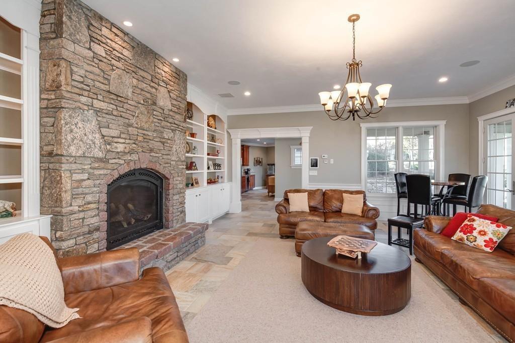 121 Douglas Road Sutton, MA 01590 - Photo 28 of 42 a living room with furniture and a fireplace