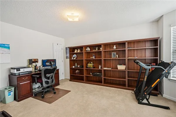 a view of a workspace with furniture