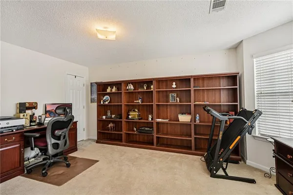 a view of a workspace with furniture