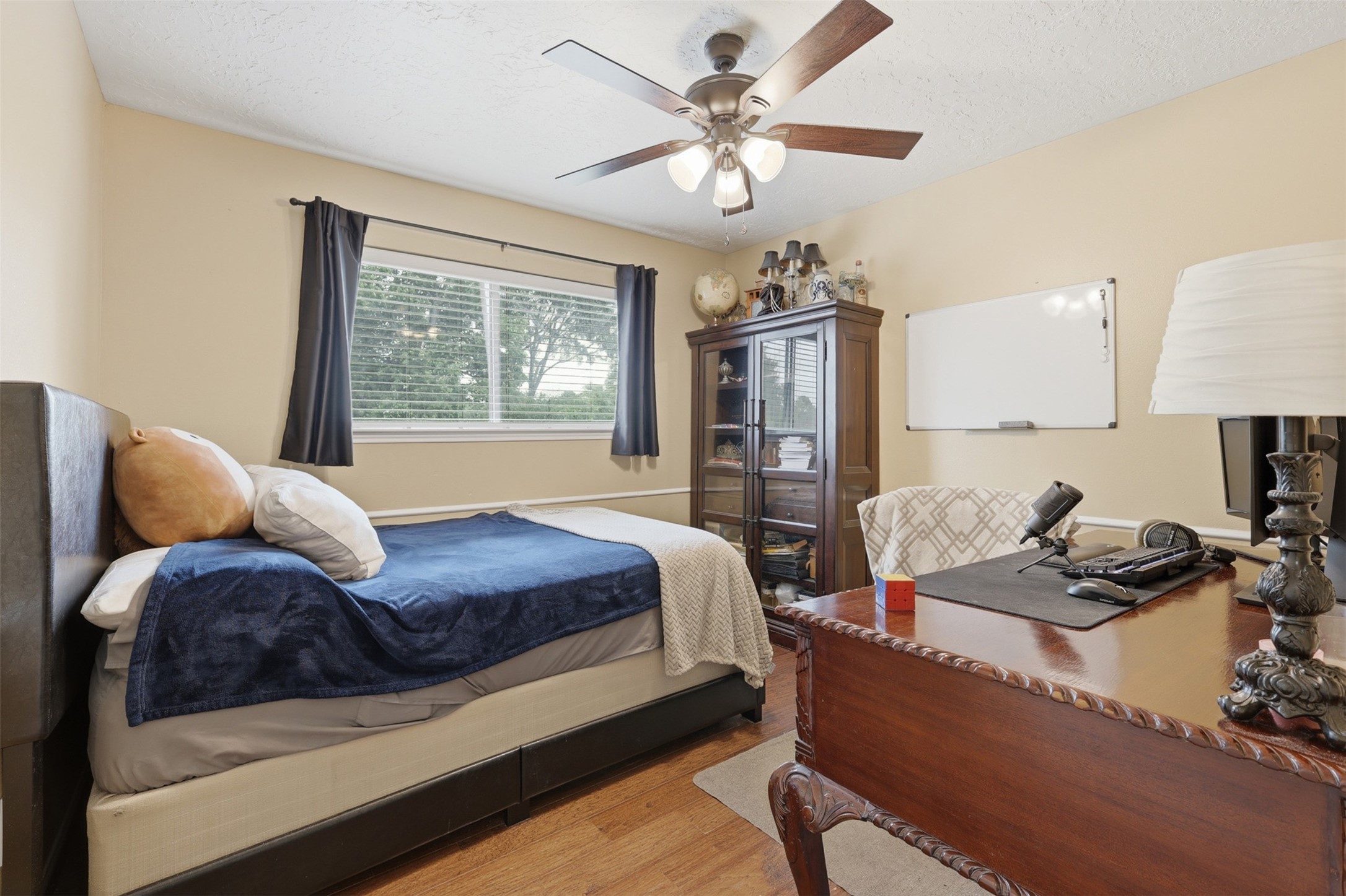 7010 River Mill Drive Spring, TX 77379 - Photo 18 of 29 a bedroom with a bed couches and window