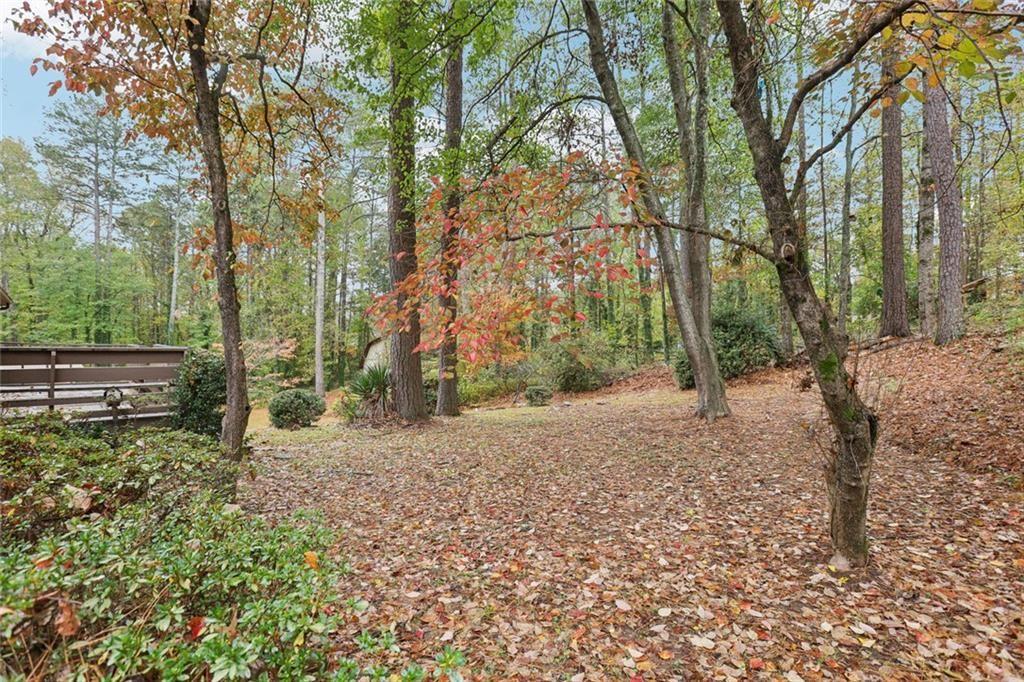 6300 East Stubbs Road Atlanta, GA 30349 - Photo 23 of 29 a backyard of a house with lots of green space