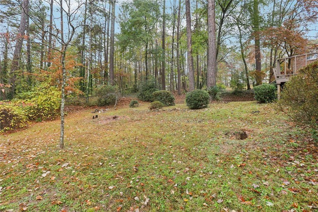 6300 East Stubbs Road Atlanta, GA 30349 - Photo 26 of 29 a backyard of a house with lots of green space