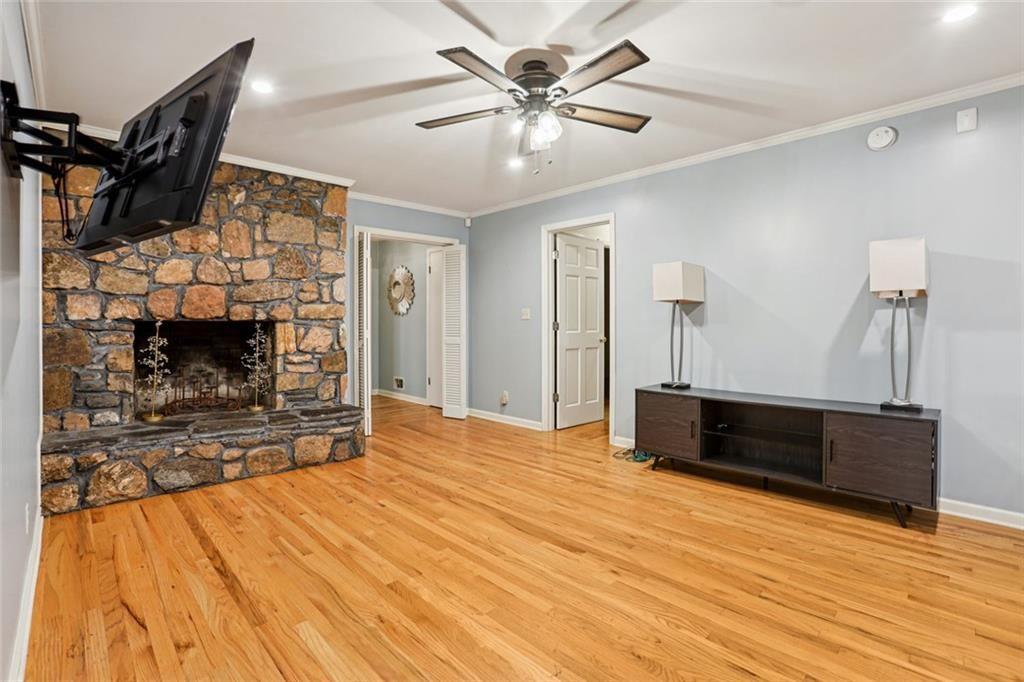 6300 East Stubbs Road Atlanta, GA 30349 - Photo 5 of 29 a bed room with a bed and a television