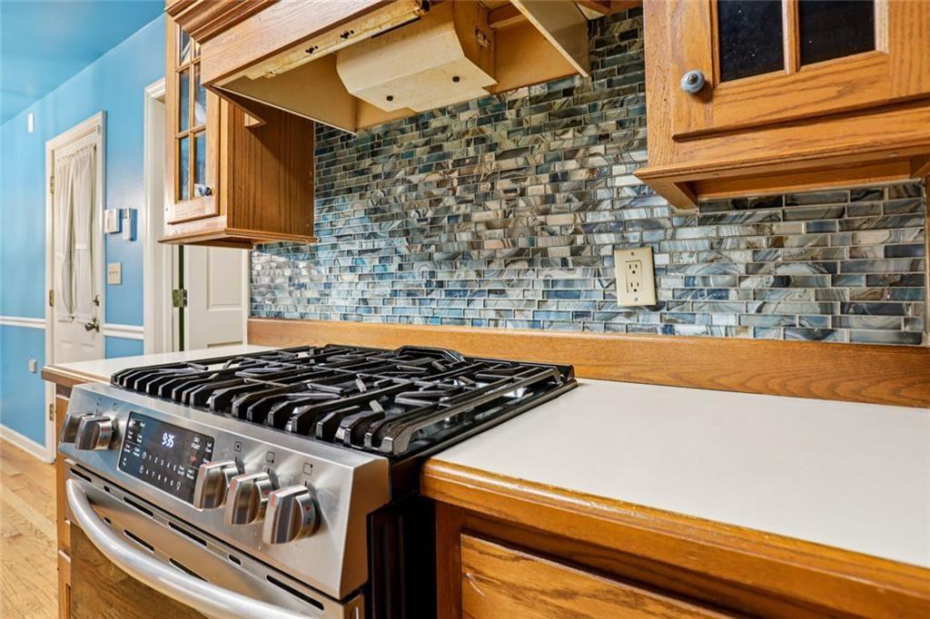6300 East Stubbs Road Atlanta, GA 30349 - Photo 9 of 29 a close view of a stove a sink and a blue roof