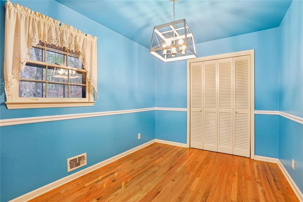 6300 East Stubbs Road Atlanta, GA 30349 - Photo 10 of 29 a view of a room with wooden floor and windows