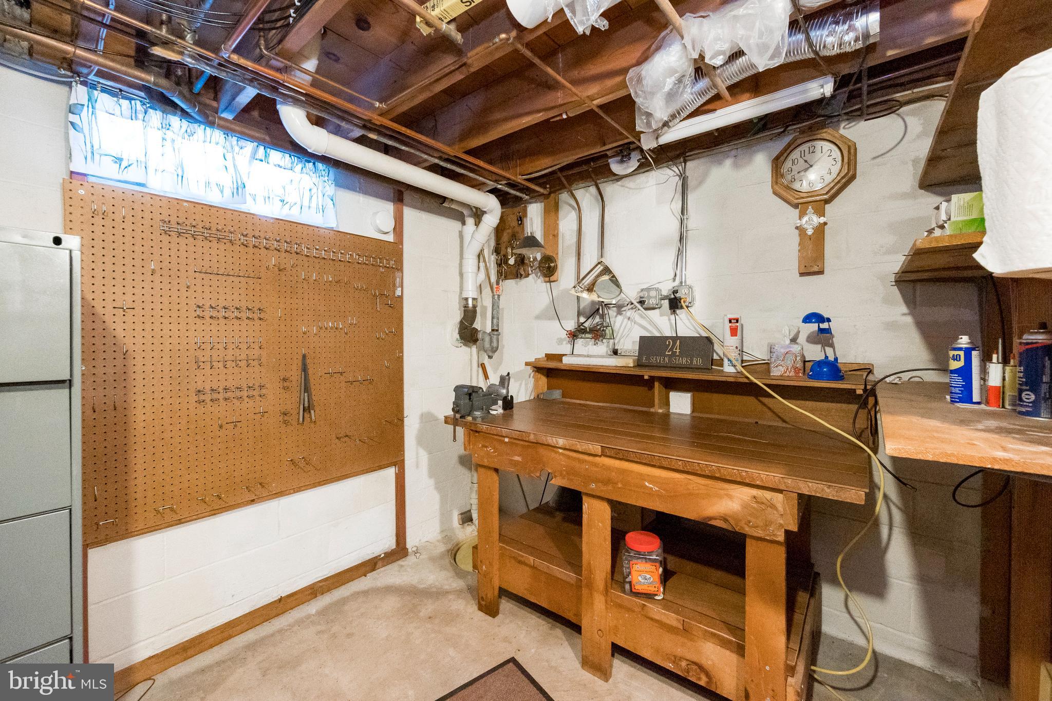 24 East 7 Stars Road Phoenixville, PA 19460 - Photo 28 of 33 Workshop Area in Unfinished Portion of Basement