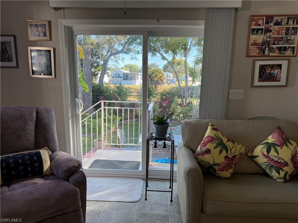 25 Bass Lane Naples, FL 34114 - Photo 11 of 17 a living room with furniture and a window