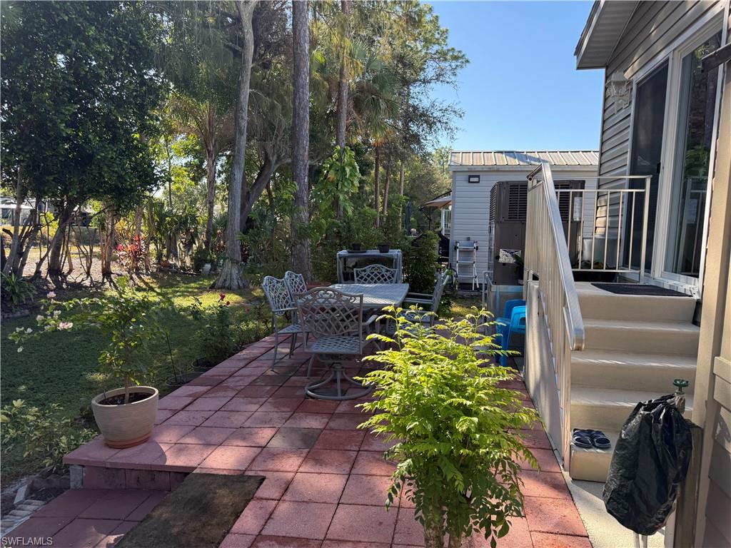 25 Bass Lane Naples, FL 34114 - Photo 12 of 17 a backyard of a house with lots of green space