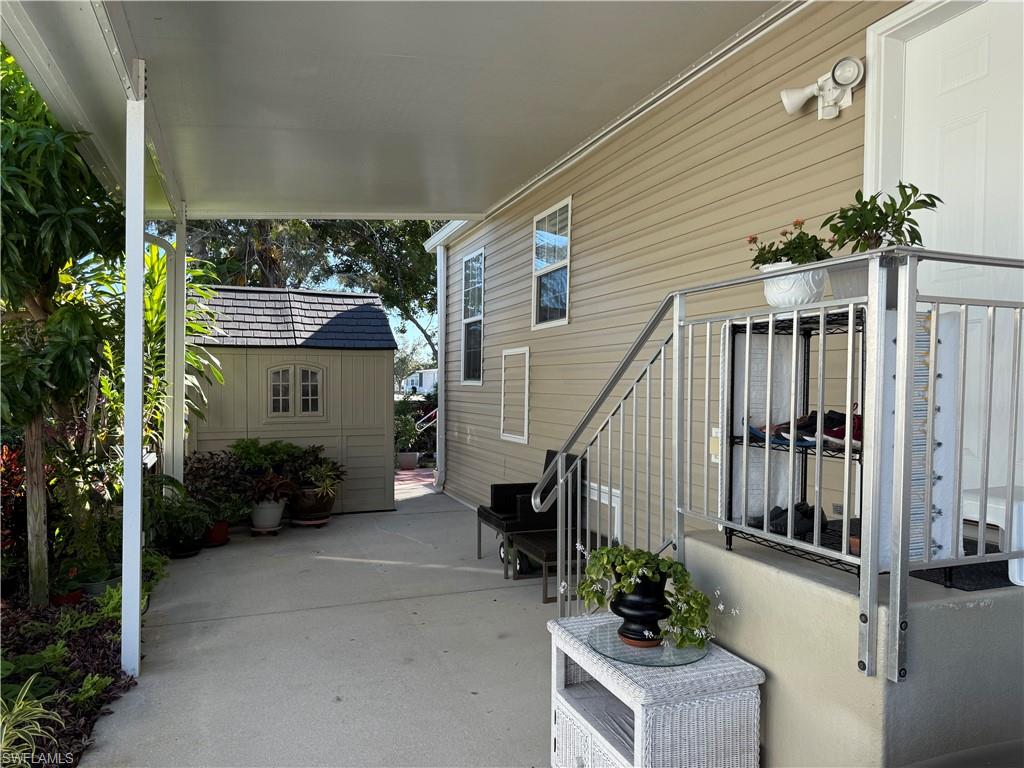 25 Bass Lane Naples, FL 34114 - Photo 2 of 17 a view of a house with backyard and furniture