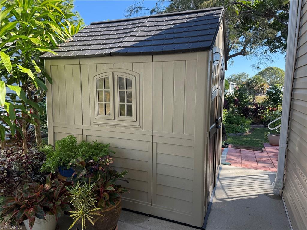 25 Bass Lane Naples, FL 34114 - Photo 3 of 17 a view of front door and potted plants