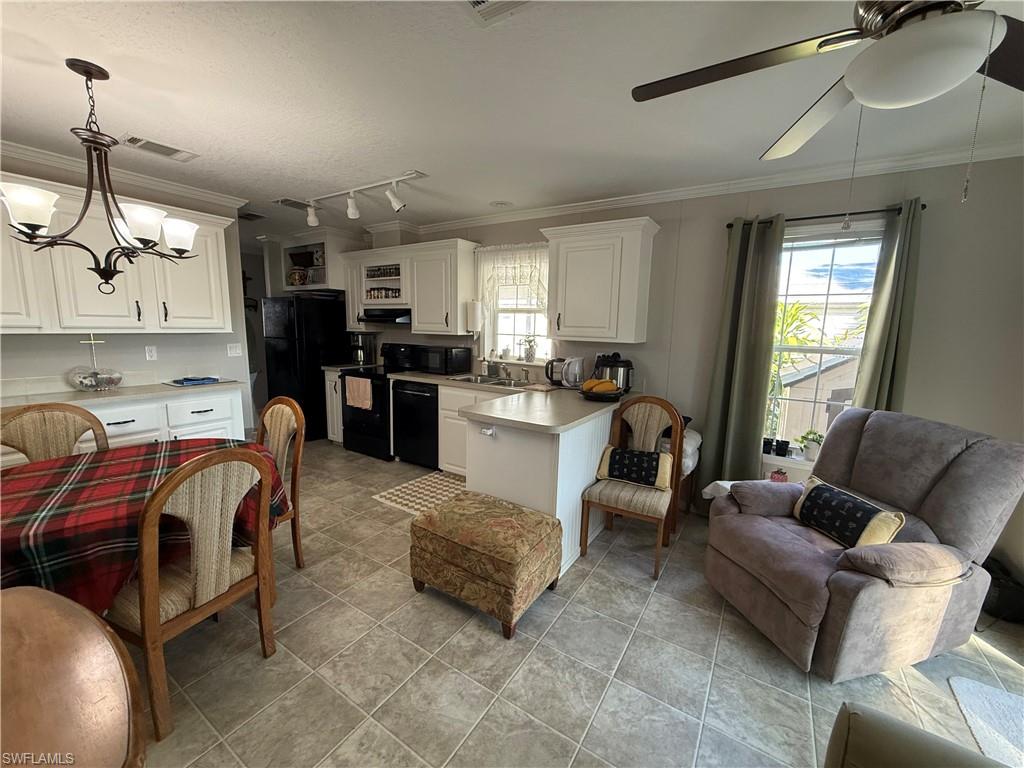 25 Bass Lane Naples, FL 34114 - Photo 16 of 17 a living room with furniture kitchen and a window