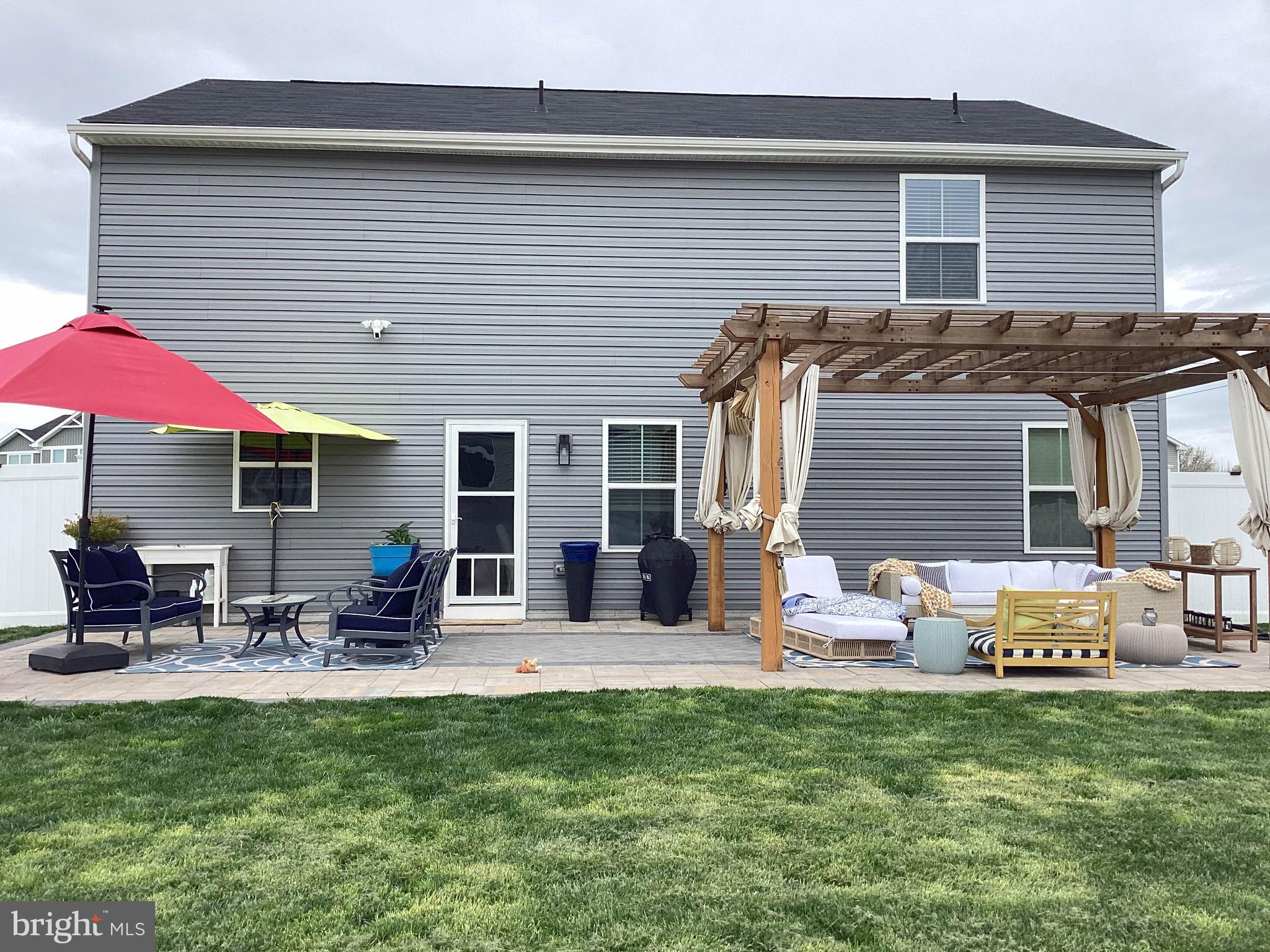 212 Bowline Drive Cambridge, MD 21613 - Photo 17 of 19 a front view of house with outdoor seating and patio