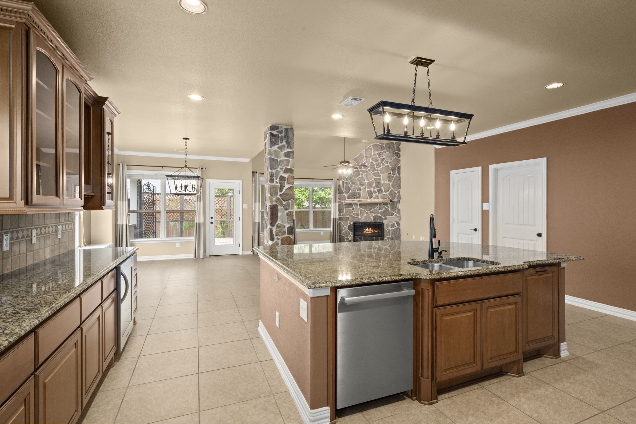 110 David Forest Lane Conroe, TX 77384 - Photo 17 of 35 a very nice looking kitchen with granite countertop a large counter top space appliances and cabinets