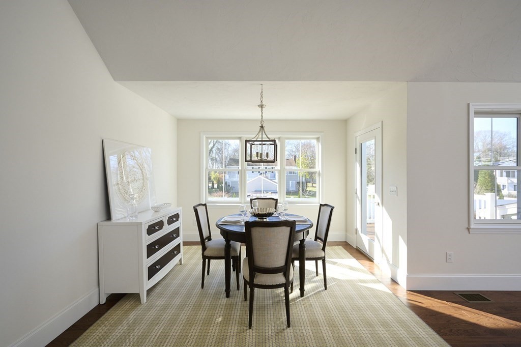 35 Metacomet Road, Unit 35 West Bridgewater, MA 02379 - Photo 11 of 34 a view of a dining room with furniture window and wooden floor