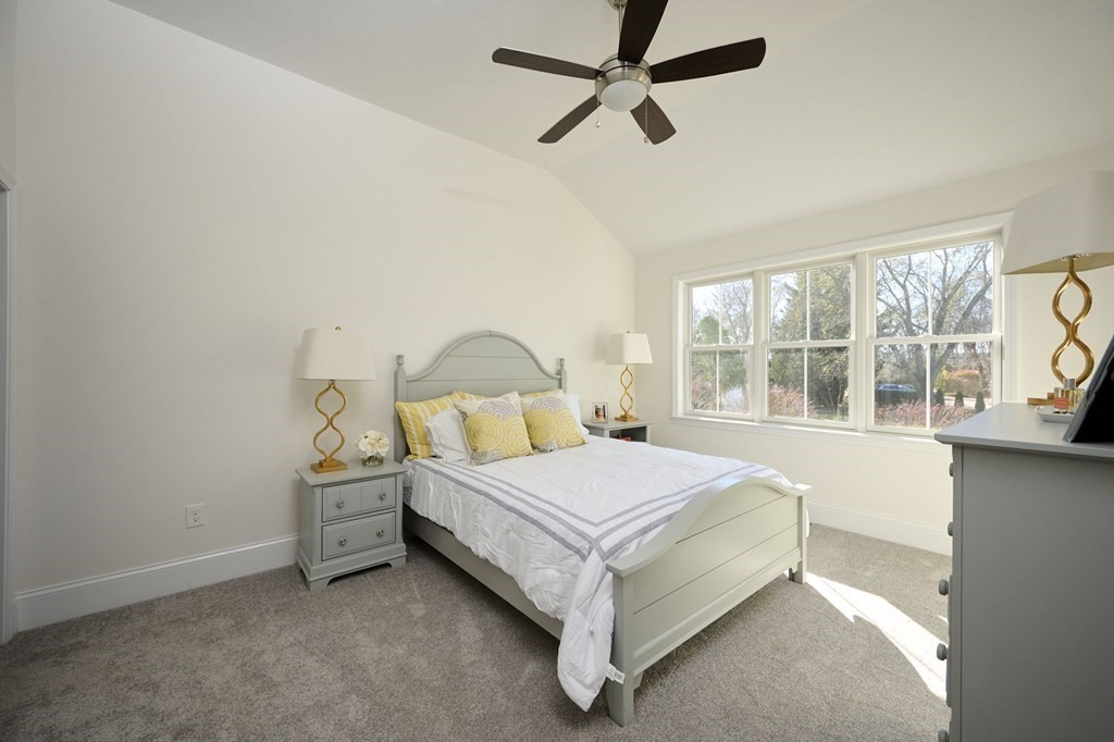 35 Metacomet Road, Unit 35 West Bridgewater, MA 02379 - Photo 13 of 34 a bed sitting in a bedroom next to a window