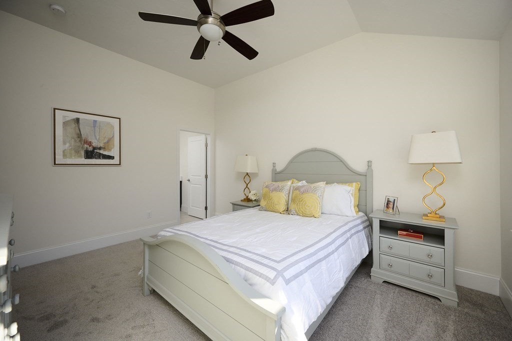 35 Metacomet Road, Unit 35 West Bridgewater, MA 02379 - Photo 14 of 34 a bedroom with a bed and a painting on the wall