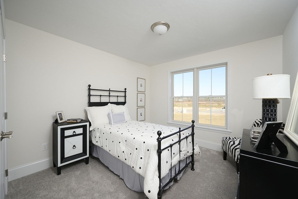 35 Metacomet Road, Unit 35 West Bridgewater, MA 02379 - Photo 18 of 34 a bedroom with a bed a couch and dresser