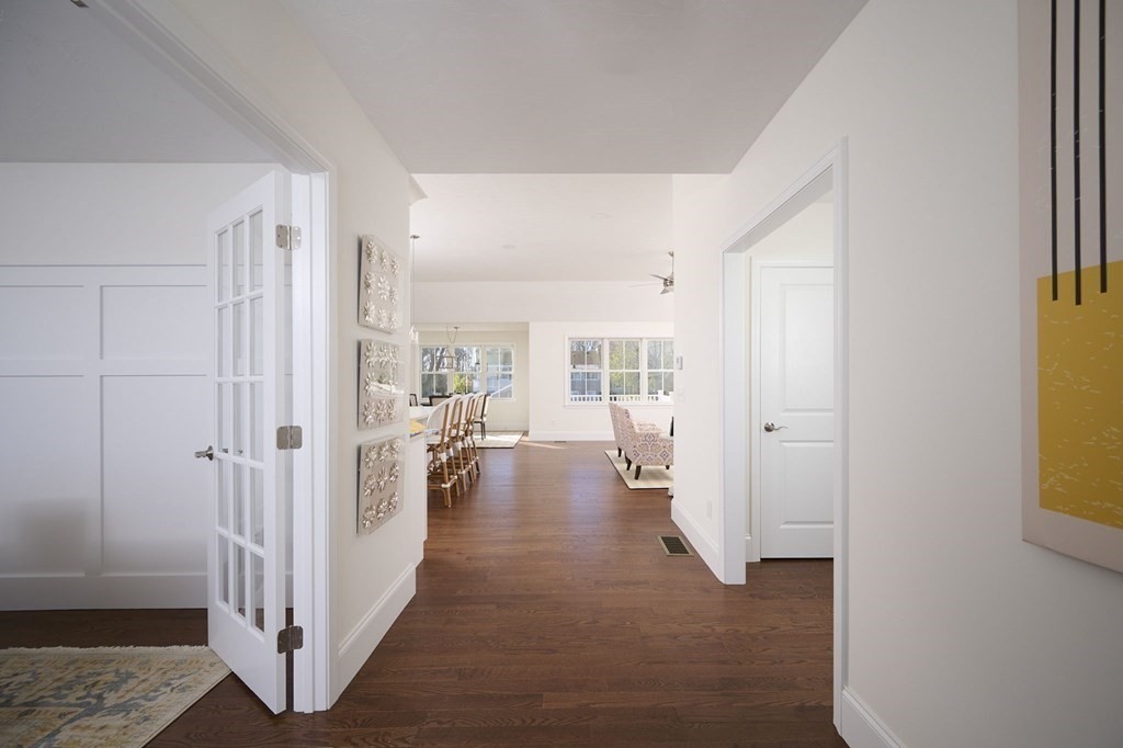 35 Metacomet Road, Unit 35 West Bridgewater, MA 02379 - Photo 2 of 34 a view of a hallway with wooden floor and a living room