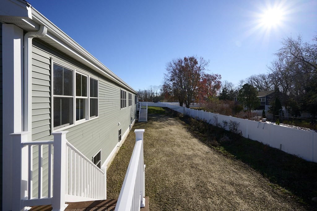 35 Metacomet Road, Unit 35 West Bridgewater, MA 02379 - Photo 23 of 34 a house view with a backyard space