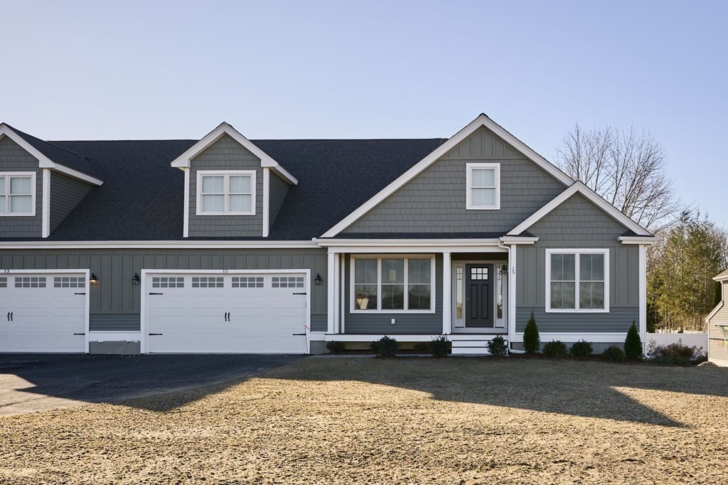 35 Metacomet Road, Unit 35 West Bridgewater, MA 02379 - Photo 24 of 34 a view of a house with a yard