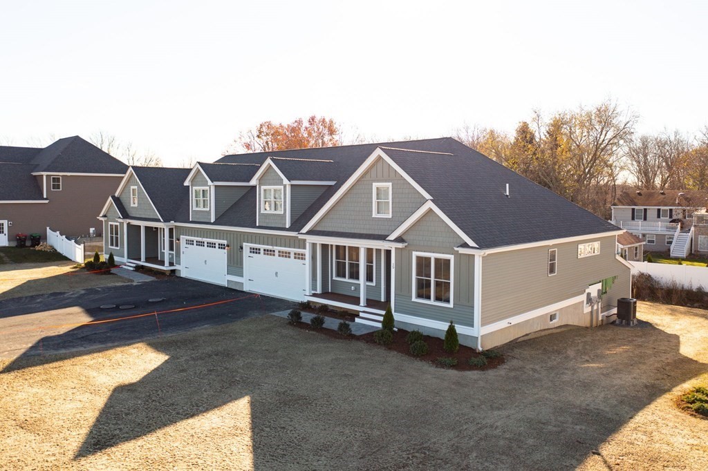 35 Metacomet Road, Unit 35 West Bridgewater, MA 02379 - Photo 25 of 34 a front view of a house with a yard