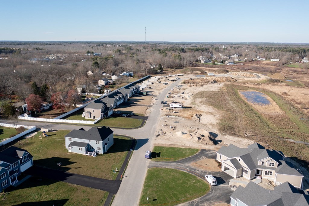 35 Metacomet Road, Unit 35 West Bridgewater, MA 02379 - Photo 33 of 34 an aerial view of residential houses with outdoor space