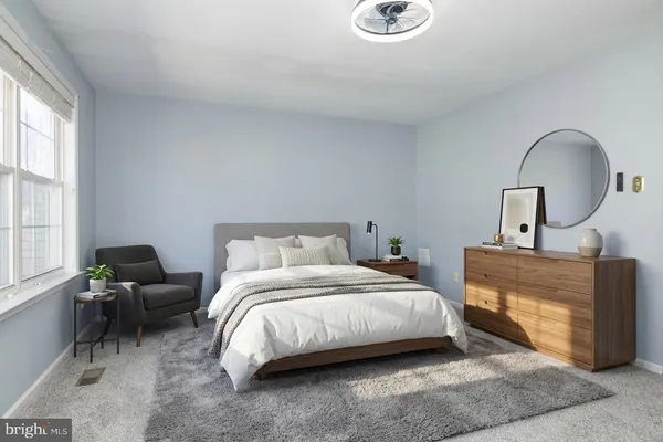 a bedroom with bed and a window
