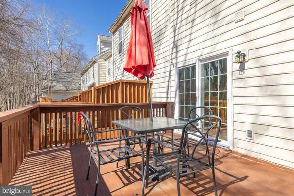 a view of a chair and table in the balcony