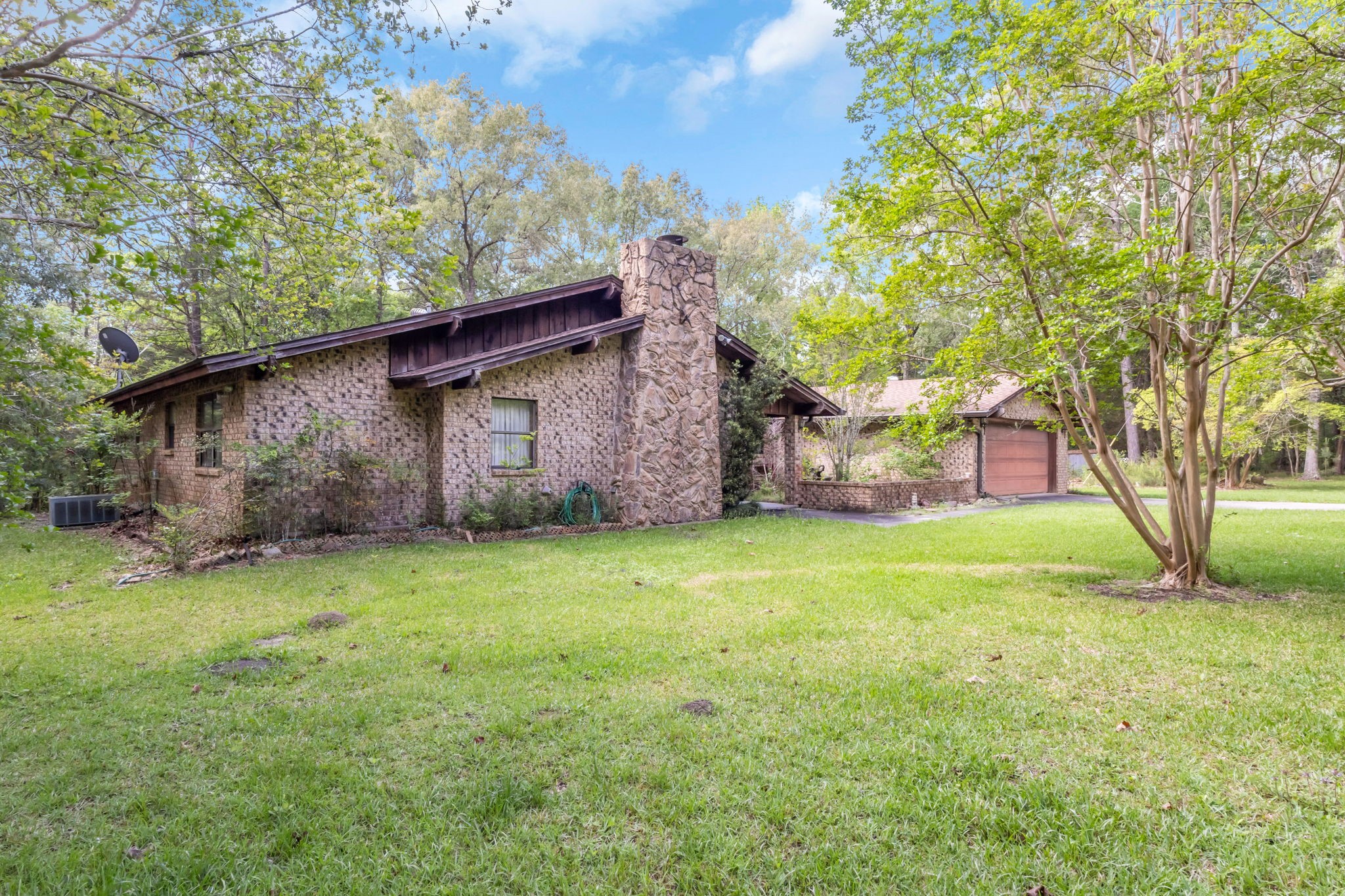 222 County Road 3085 Colmesneil, TX 75938 - Photo 19 of 50 a backyard of a house with lots of green space