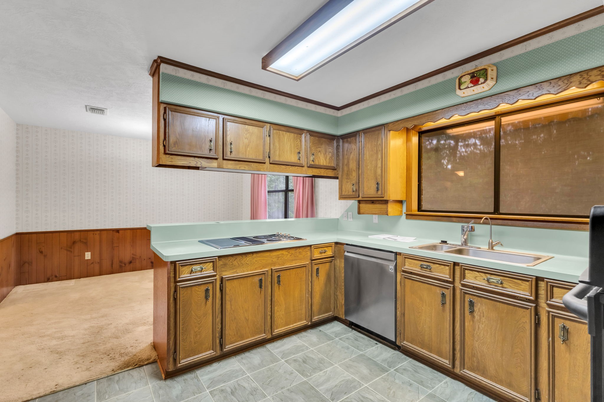 222 County Road 3085 Colmesneil, TX 75938 - Photo 20 of 50 a kitchen with a sink stove and cabinets