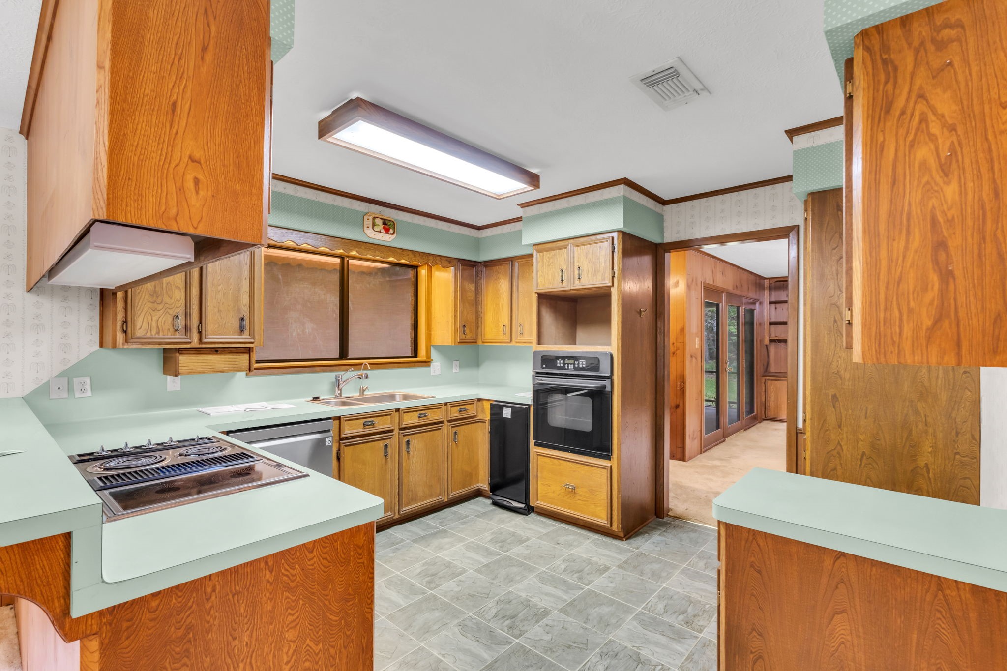 222 County Road 3085 Colmesneil, TX 75938 - Photo 28 of 50 a kitchen with stainless steel appliances granite countertop a stove a sink and a refrigerator