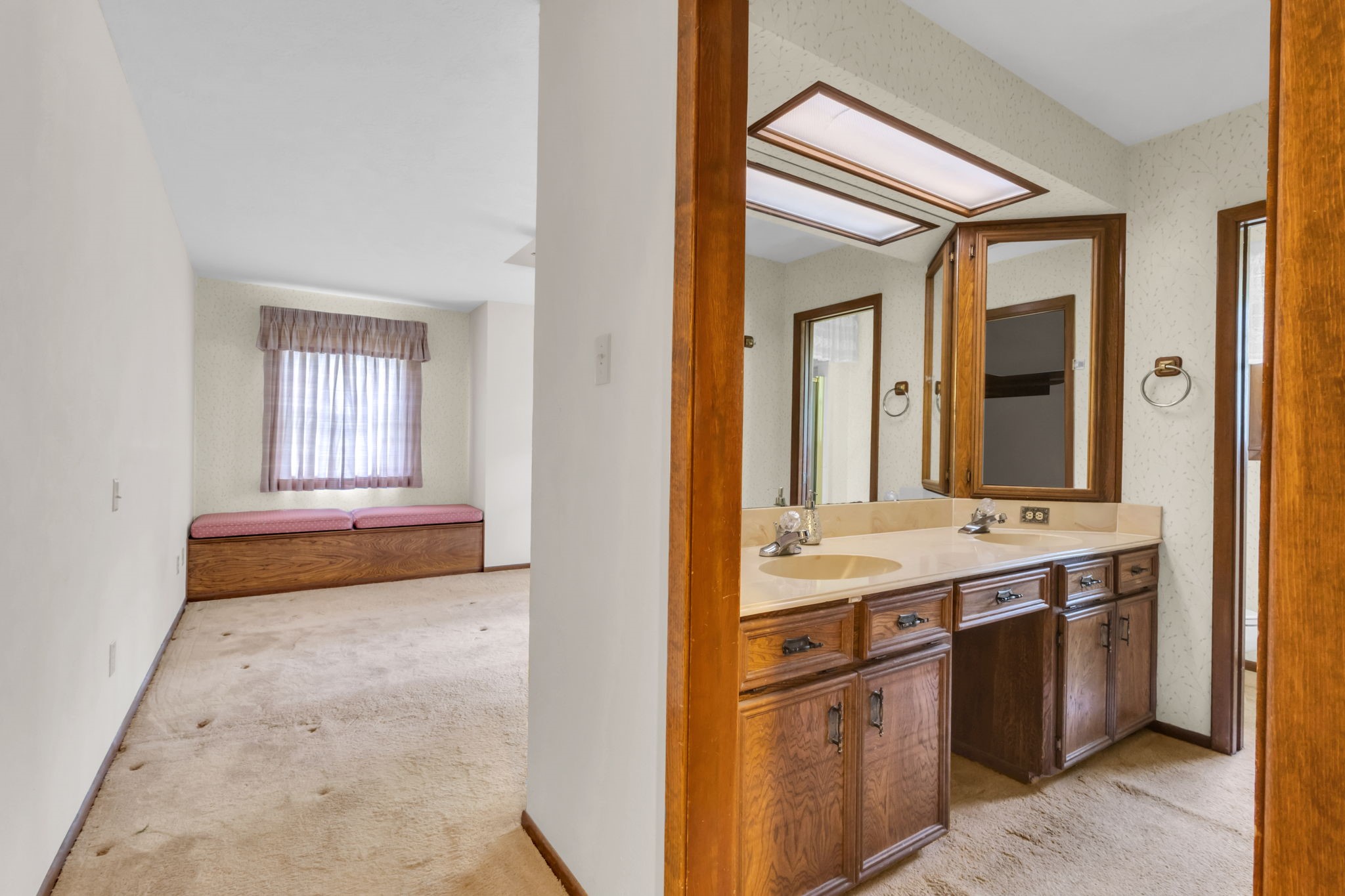 222 County Road 3085 Colmesneil, TX 75938 - Photo 32 of 50 a bathroom with a granite countertop sink and a mirror