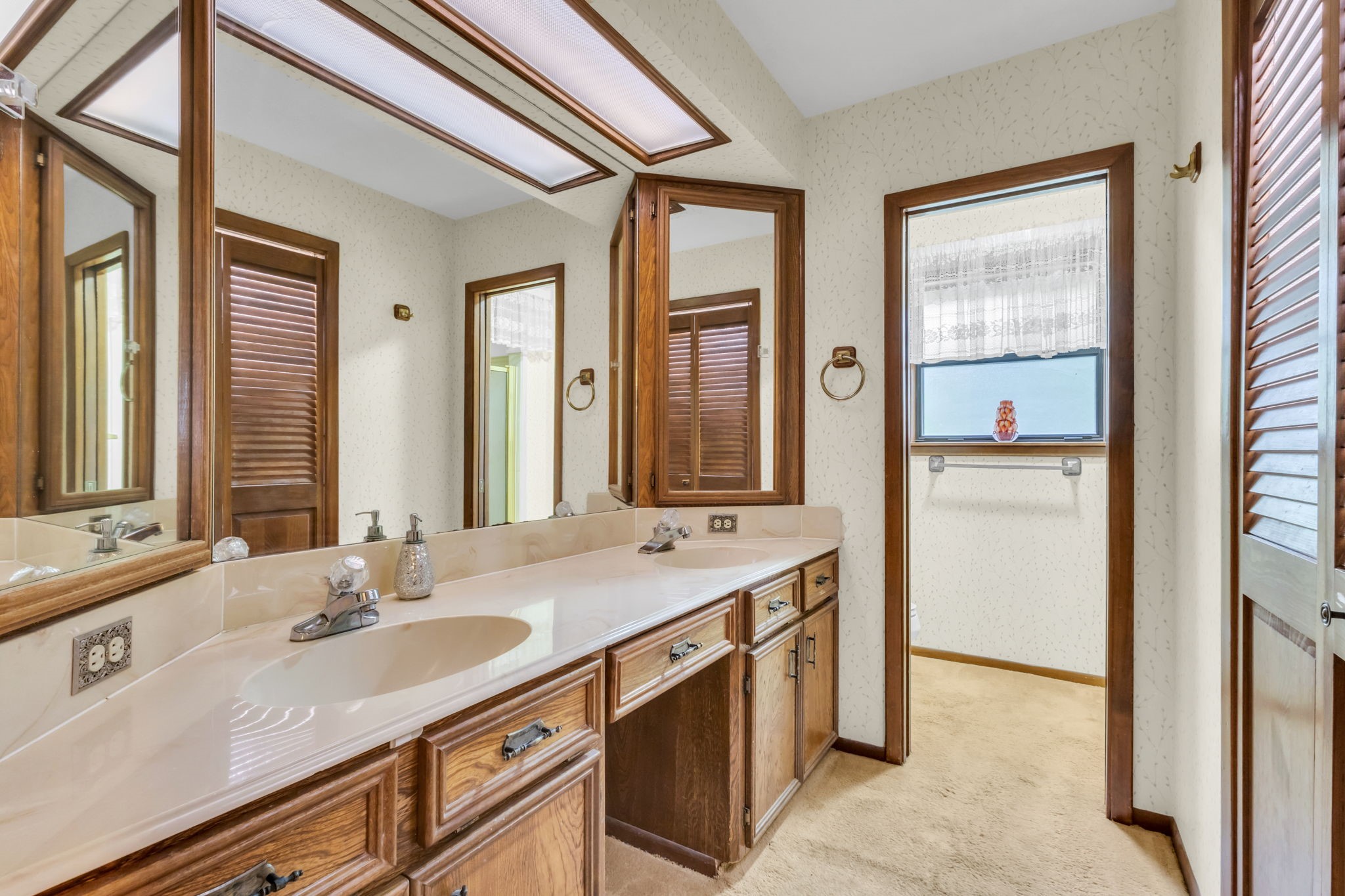 222 County Road 3085 Colmesneil, TX 75938 - Photo 33 of 50 a bathroom with a sink double vanity and a mirror