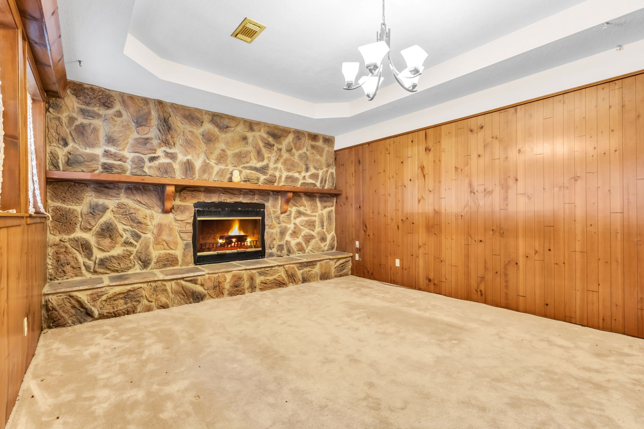 222 County Road 3085 Colmesneil, TX 75938 - Photo 4 of 50 a view of empty room with fireplace and fan
