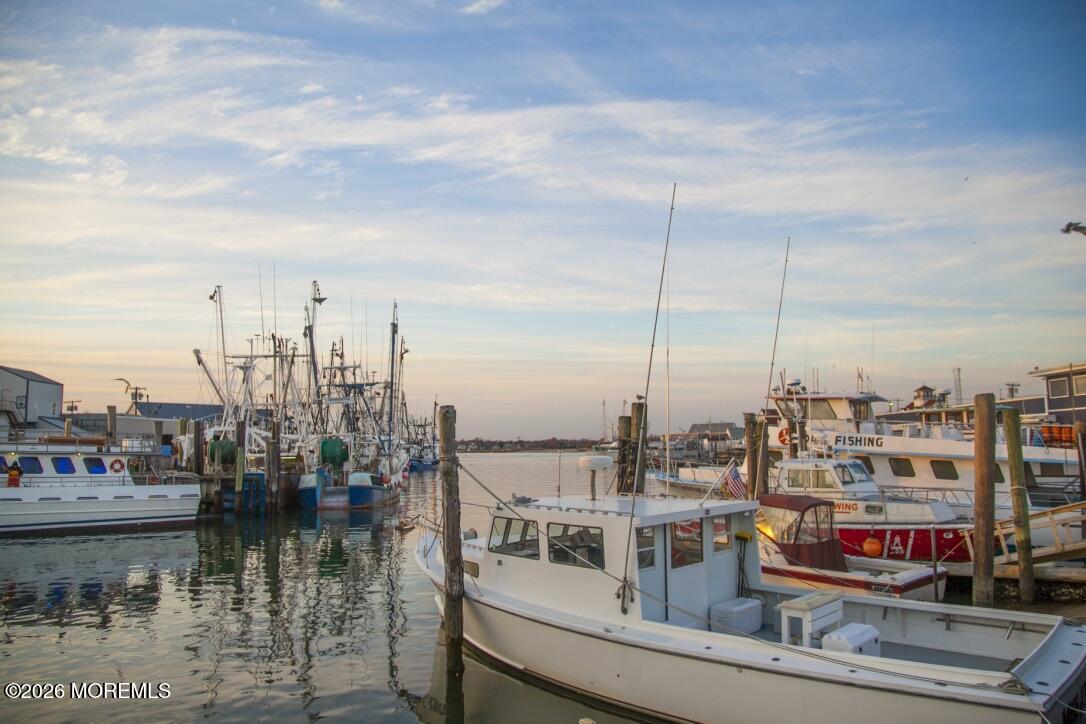 32 Abbey Road Brick, NJ 08723 - Photo 19 of 44 a view of a lake and yard