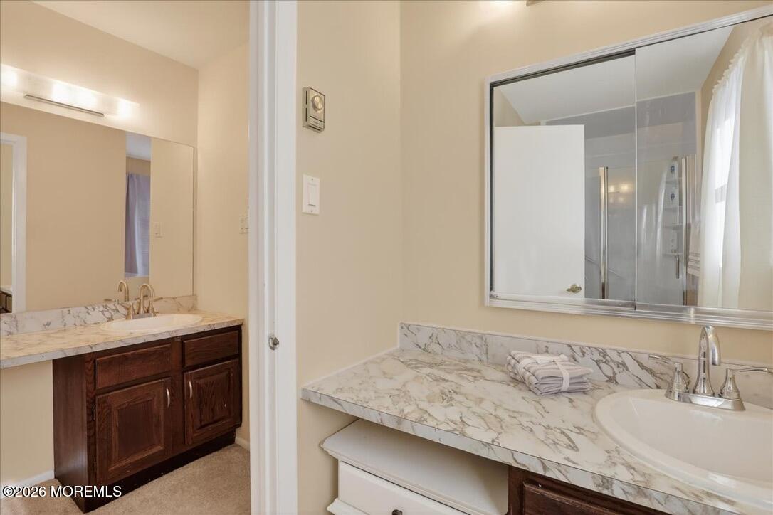 32 Abbey Road Brick, NJ 08723 - Photo 23 of 42 a bathroom with a granite countertop sink and a mirror