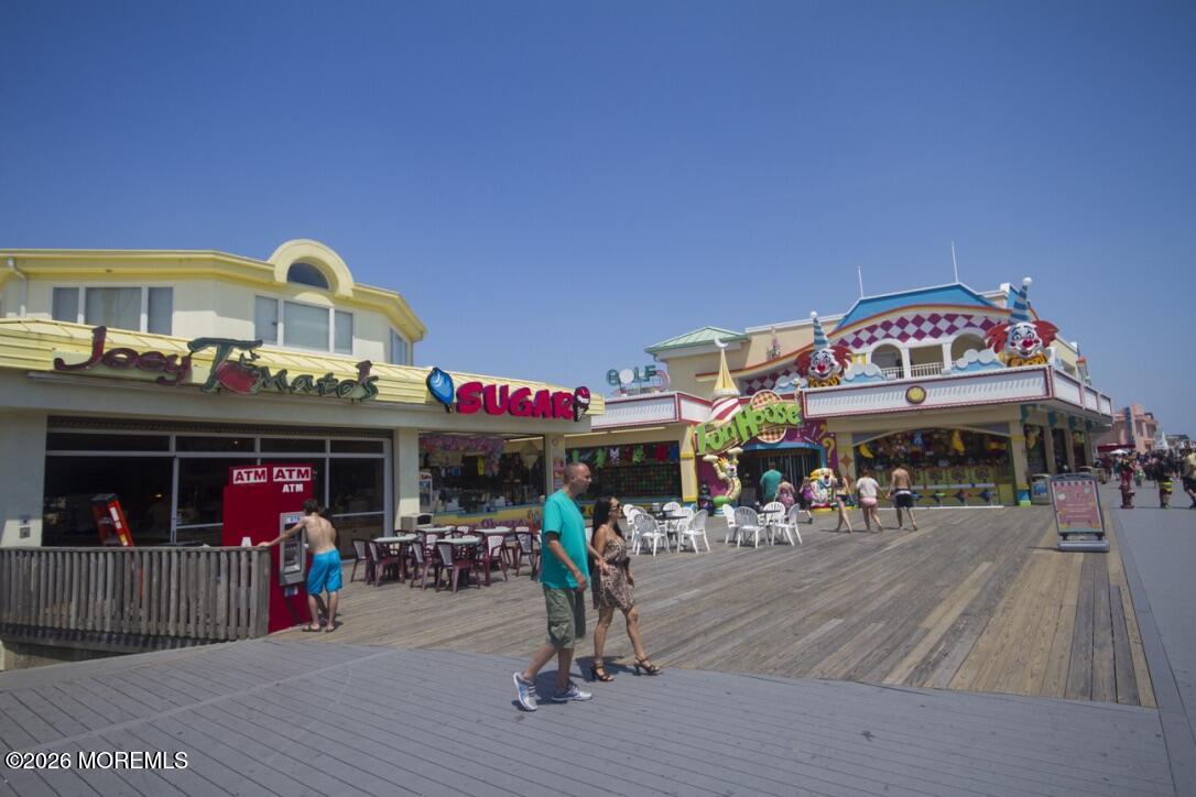 32 Abbey Road Brick, NJ 08723 - Photo 37 of 42 a view of people sitting in front of retail shop
