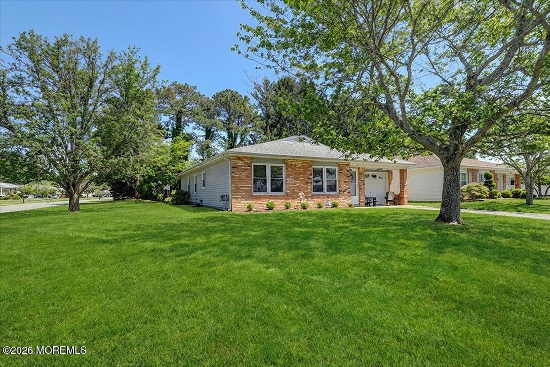 32 Abbey Road Brick, NJ 08723 - Photo 7 of 44 a front view of a house with yard and green space