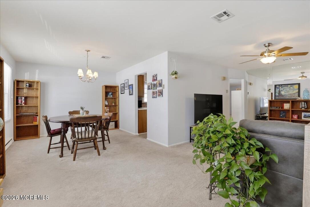 32 Abbey Road Brick, NJ 08723 - Photo 7 of 42 a view of a dining room with furniture and chandelier