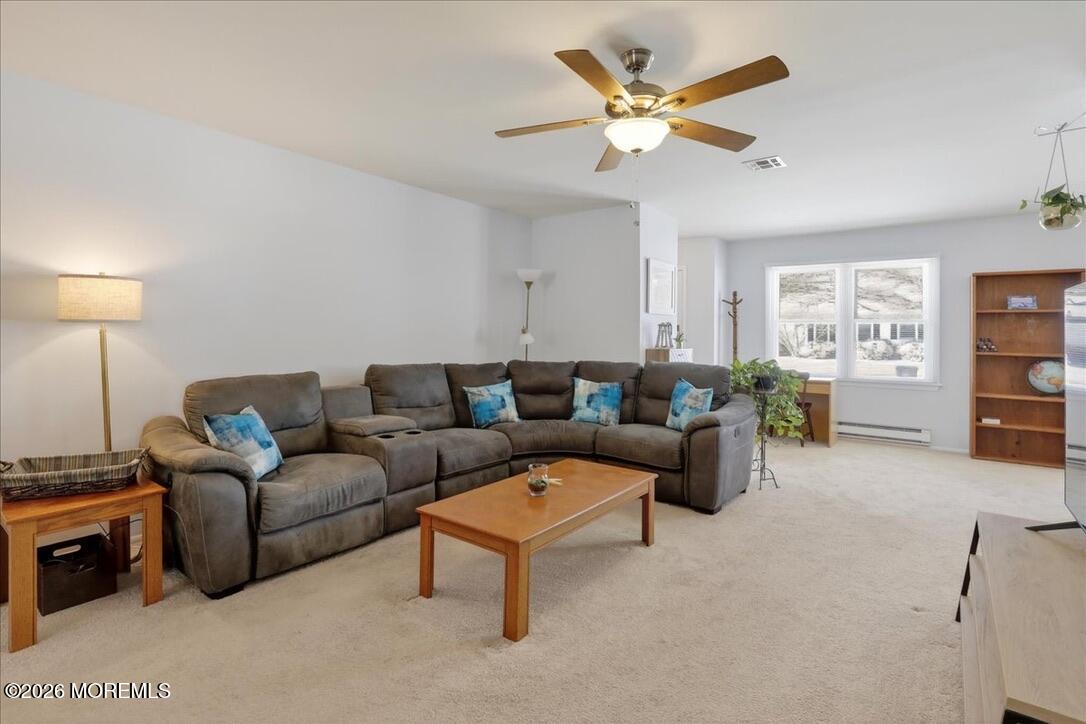32 Abbey Road Brick, NJ 08723 - Photo 8 of 44 a living room with furniture a ceiling fan and a window