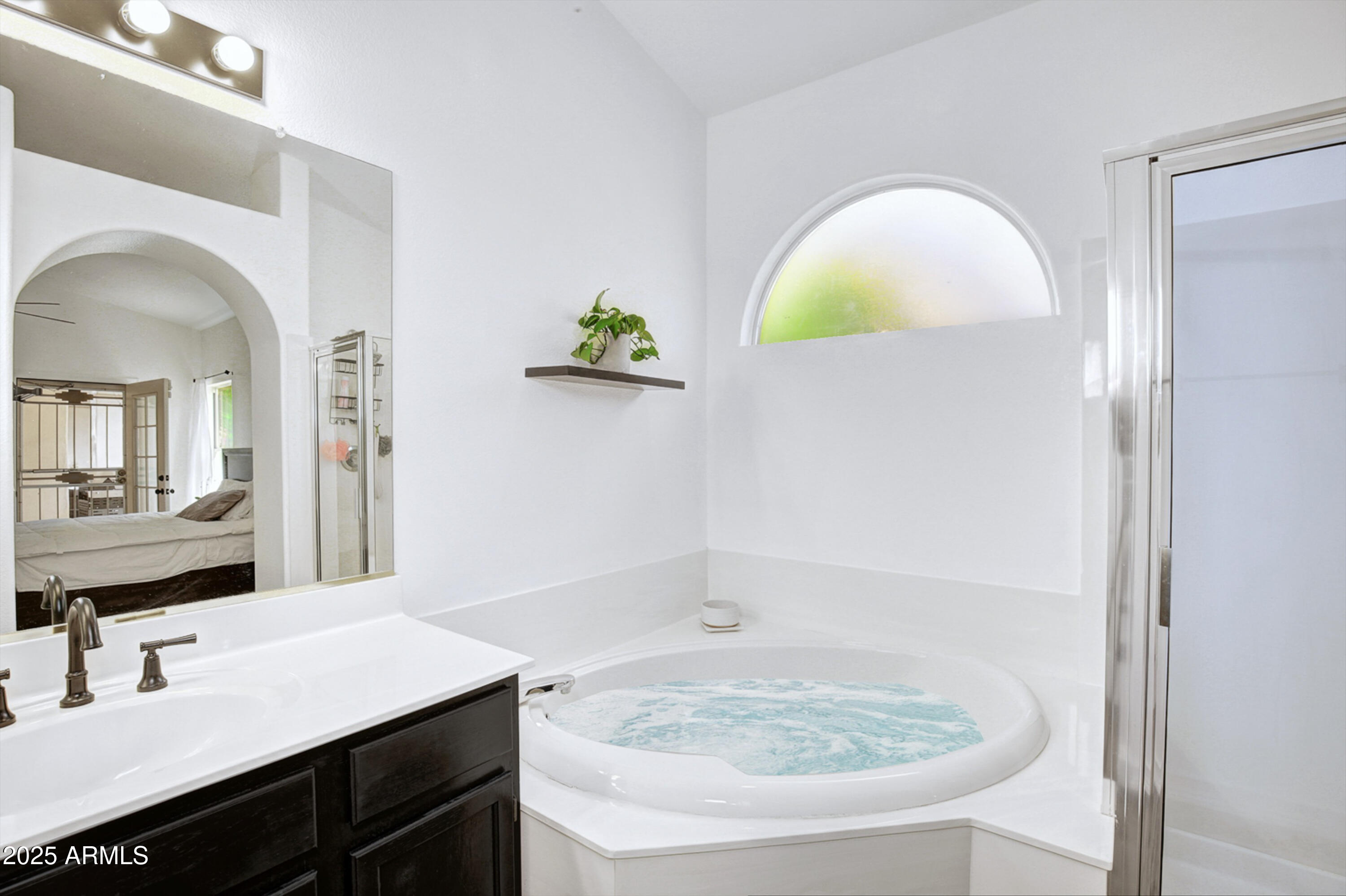 6458 East Raftriver Street Mesa, AZ 85215 - Photo 41 of 75 a bathroom with a sink and a mirror