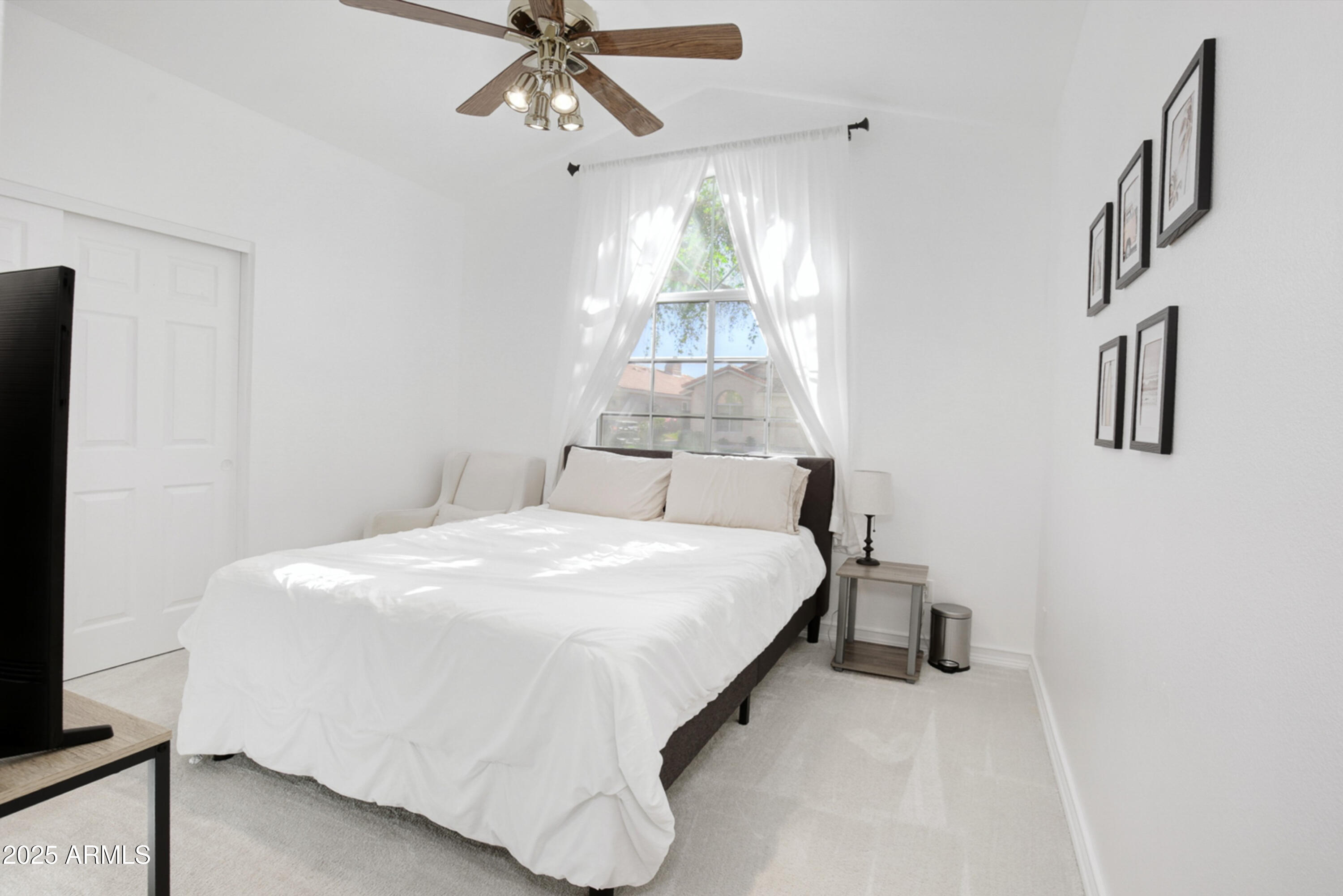 6458 East Raftriver Street Mesa, AZ 85215 - Photo 42 of 75 a bedroom with a bed and a chandelier
