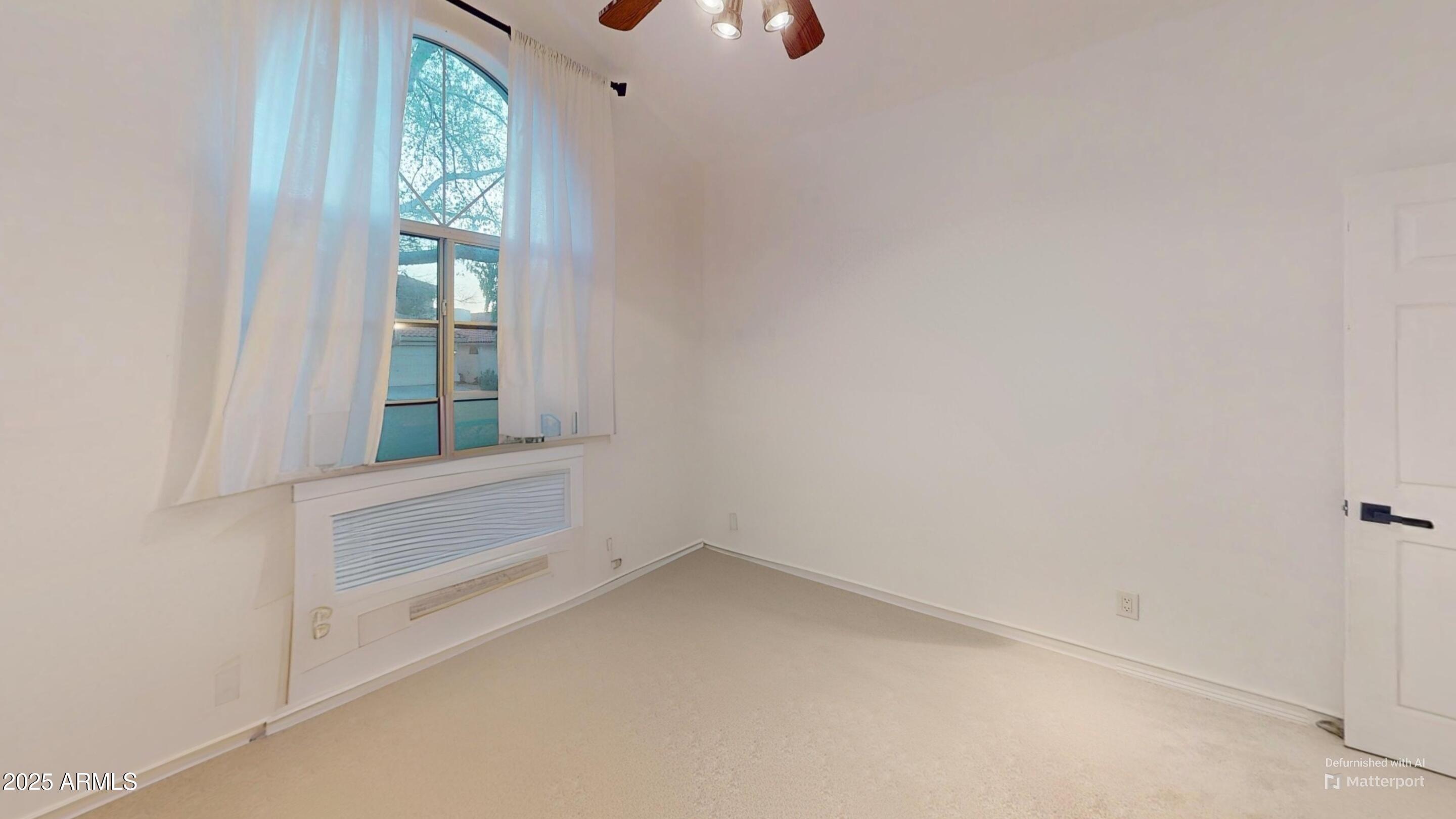 6458 East Raftriver Street Mesa, AZ 85215 - Photo 43 of 75 an empty room with windows and entrance