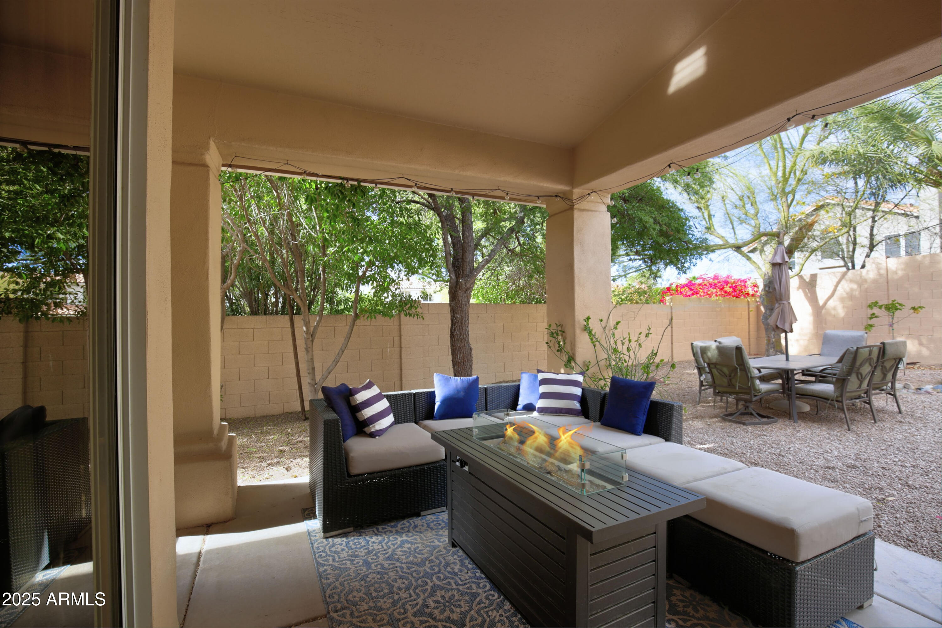 6458 East Raftriver Street Mesa, AZ 85215 - Photo 50 of 75 a living room with furniture and a large window