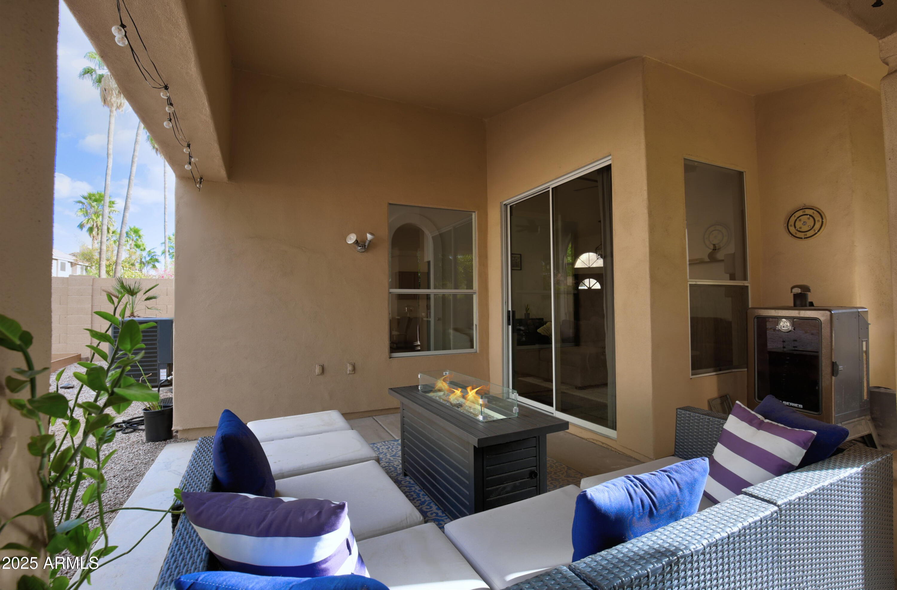 6458 East Raftriver Street Mesa, AZ 85215 - Photo 52 of 75 a living room with furniture and a potted plant