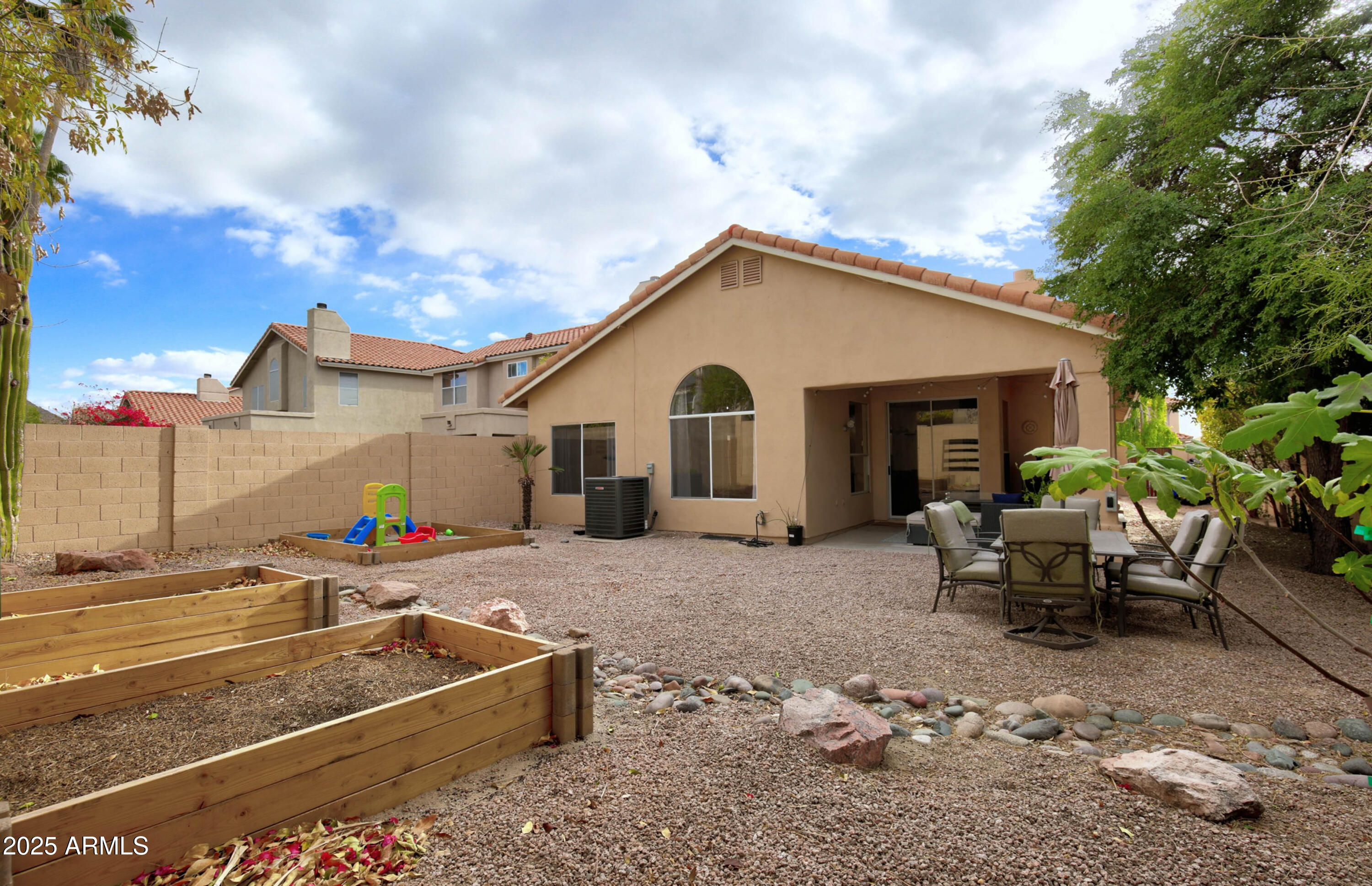 6458 East Raftriver Street Mesa, AZ 85215 - Photo 54 of 75 a view of a house with backyard and sitting area