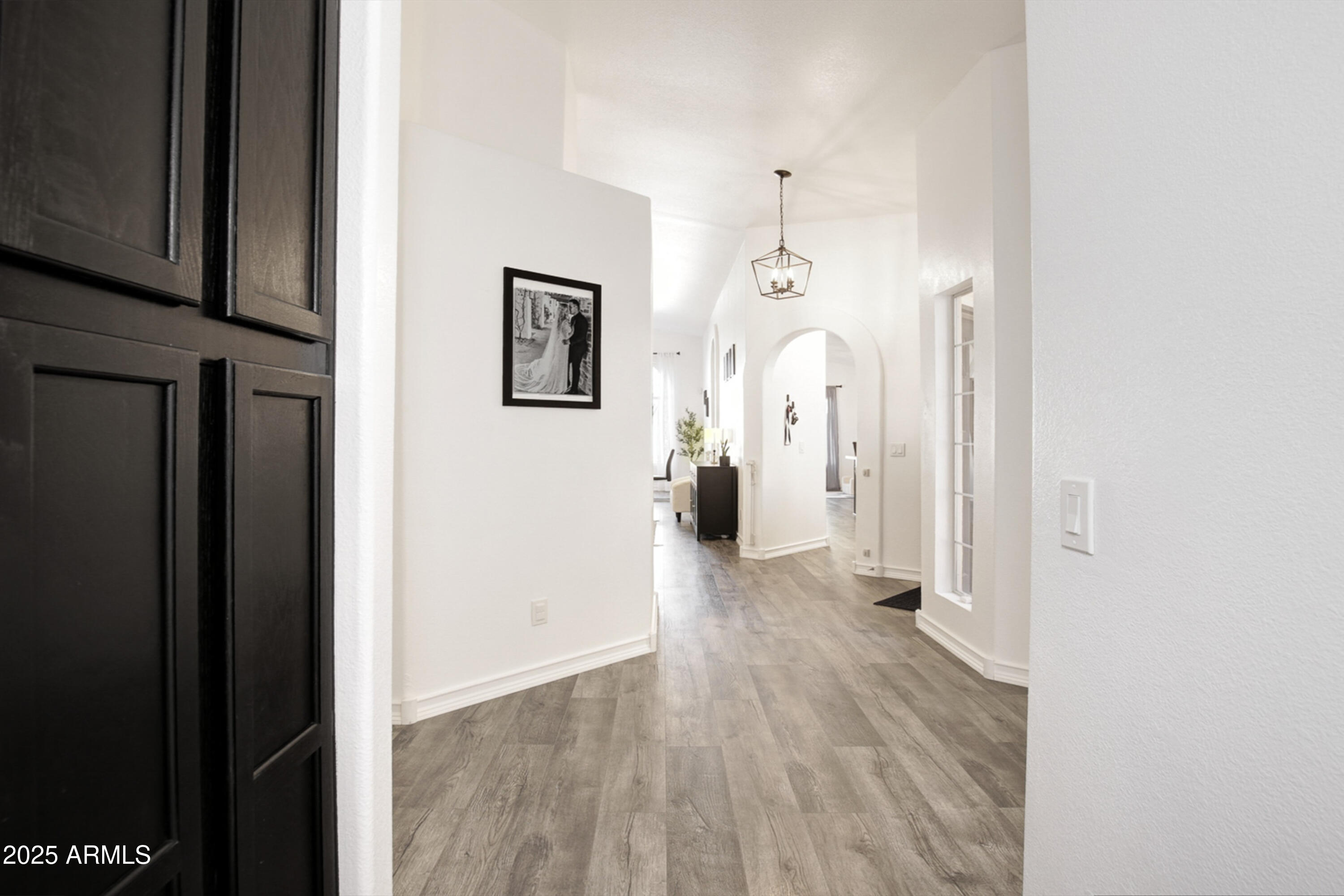 6458 East Raftriver Street Mesa, AZ 85215 - Photo 10 of 75 a view of a hallway with wooden floor