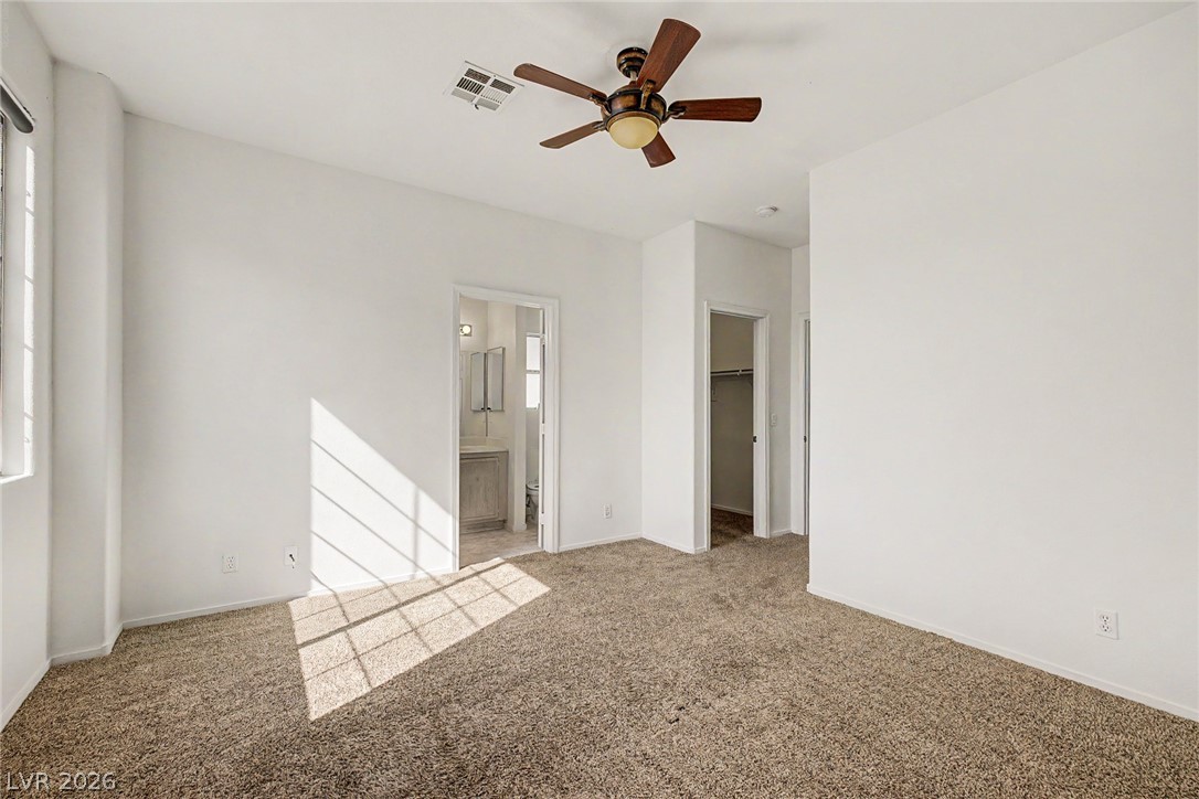 2223 Ramsgate Drive Henderson, NV 89074 - Photo 14 of 32 A versatile bedroom offering comfort and functionality, with access to a personal bath and walk-in closet.