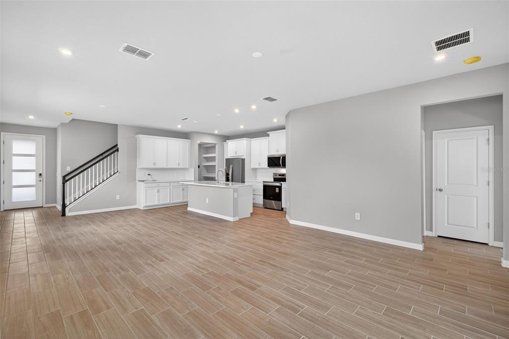 3350 Timber Xing Avenue Brandon, FL 33511 - Photo 13 of 35 a view of a kitchen with wooden floor and electronic appliances